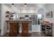 Eat-in kitchen with stainless appliances, granite counters and breakfast bar open to living spaces at 409 E Frances Ave, Tampa, FL 33602