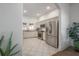 Bright kitchen featuring stainless steel appliances, granite countertops and white cabinets at 409 E Frances Ave, Tampa, FL 33602