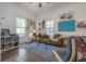 Bright living room with large windows, modern decor, and stylish furnishings at 409 E Frances Ave, Tampa, FL 33602