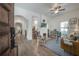 Bright living room featuring hardwood floors, a brick fireplace, modern lighting, and stylish furniture at 409 E Frances Ave, Tampa, FL 33602