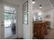 Bright living room featuring modern decor, breakfast bar, and view of the back porch at 409 E Frances Ave, Tampa, FL 33602