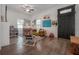 Bright living room with hardwood floors and many windows offering abundant natural light at 409 E Frances Ave, Tampa, FL 33602