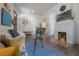 Stylish living room featuring a white brick fireplace, hardwood floors, and comfortable furniture at 409 E Frances Ave, Tampa, FL 33602