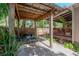 Outdoor patio with dining set, BBQ, and a covered seating area, perfect for entertaining guests at 409 E Frances Ave, Tampa, FL 33602