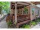 Inviting porch with outdoor seating and landscaping, perfect for enjoying the serene surroundings at 409 E Frances Ave, Tampa, FL 33602