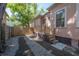 Home exterior featuring a gated driveway and a staircase leading to a side entrance at 409 E Frances Ave, Tampa, FL 33602