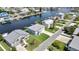 Aerial shot of waterfront houses with docks, manicured lawns, and easy water access at 4123 Daisy Dr, Hernando Beach, FL 34607