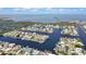 Expansive aerial view showcasing waterfront property with access to the ocean, surrounded by lush wetlands at 4123 Daisy Dr, Hernando Beach, FL 34607