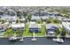 Captivating aerial view of waterfront homes, complete with boat docks, surrounded by lush greenery and waterways at 4123 Daisy Dr, Hernando Beach, FL 34607