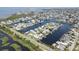 Wide aerial shot of a neighborhood on the water, showing private docks and lush green surroundings at 4123 Daisy Dr, Hernando Beach, FL 34607