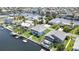 Expansive aerial view of waterfront homes with boat docks, enveloped by lush landscapes and waterways at 4123 Daisy Dr, Hernando Beach, FL 34607