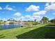 Beautiful backyard with lush green lawn and waterfront canal view, offering a serene and picturesque setting at 4123 Daisy Dr, Hernando Beach, FL 34607