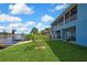 Lovely landscaped backyard features a waterfront view and covered patio, perfect for outdoor entertaining at 4123 Daisy Dr, Hernando Beach, FL 34607