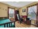 Comfortable bedroom with a full-sized bed, wood floors, and natural lighting at 4123 Daisy Dr, Hernando Beach, FL 34607