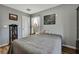 Bedroom with wood floors and decor, featuring natural light and a modern aesthetic at 4123 Daisy Dr, Hernando Beach, FL 34607