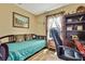 Cozy bedroom featuring a daybed, wood floors, and a decorative bookshelf at 4123 Daisy Dr, Hernando Beach, FL 34607
