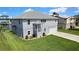 Attractive two-story home with a manicured lawn, featuring a welcoming entrance and an attached garage at 4123 Daisy Dr, Hernando Beach, FL 34607