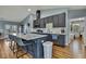 Modern kitchen features a large island with a quartz countertop and stainless steel appliances at 4123 Daisy Dr, Hernando Beach, FL 34607