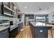 Well-equipped kitchen with stainless steel appliances, modern cabinetry, and an island with bar seating at 4123 Daisy Dr, Hernando Beach, FL 34607
