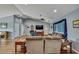 Bright and airy living room with vaulted ceiling, hardwood floors, and a cozy seating area near an entertainment center at 4123 Daisy Dr, Hernando Beach, FL 34607