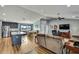Open-concept living space combining the kitchen, dining, and living areas for seamless entertaining and Gathering time at 4123 Daisy Dr, Hernando Beach, FL 34607