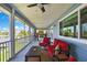 Spacious screened porch with comfortable seating and scenic waterfront views at 4123 Daisy Dr, Hernando Beach, FL 34607