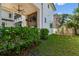 Beautiful backyard of home with manicured lawn, greenery, and an outdoor play set for children at 443 Lucerne Ave, Tampa, FL 33606