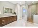 Modern bathroom featuring a glass enclosed shower, stylish vanity, and contemporary finishes at 443 Lucerne Ave, Tampa, FL 33606