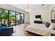 Spacious bedroom with hardwood floors, balcony access and large window views at 443 Lucerne Ave, Tampa, FL 33606