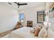 Cozy bedroom with a large teddy bear, soft pillows, and ample natural light from the windows at 443 Lucerne Ave, Tampa, FL 33606