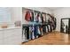 Spacious walk-in closet with custom shelving and organization system for clothing and accessories at 443 Lucerne Ave, Tampa, FL 33606