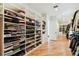 Large walk-in closet with extensive shelving and storage solutions for clothes, shoes, and accessories at 443 Lucerne Ave, Tampa, FL 33606