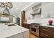 Stylish kitchen featuring stone countertops, custom cabinets, and stainless steel appliances at 443 Lucerne Ave, Tampa, FL 33606
