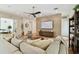 Inviting living room featuring hardwood floors, modern furnishings, a stone wall, and ample seating at 443 Lucerne Ave, Tampa, FL 33606