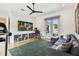 Inviting living room with hardwood flooring, entertainment center, and access to a private balcony at 443 Lucerne Ave, Tampa, FL 33606