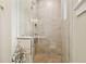 Modern tiled shower with glass enclosure, bench, and sleek fixtures at 443 Lucerne Ave, Tampa, FL 33606