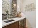 Modern wet bar featuring a wine fridge, stone backsplash, and stylish decor at 443 Lucerne Ave, Tampa, FL 33606