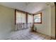 Bedroom with tile floors, curtains, and natural light at 4479 Newark N St, St Petersburg, FL 33714