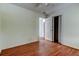 View of the bedroom with wood flooring, white walls, closet, and open door at 4479 Newark N St, St Petersburg, FL 33714