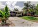 Single-story home with a charming front yard and driveway at 4479 Newark N St, St Petersburg, FL 33714