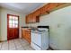 Kitchen featuring wooden cabinets and a white stove at 4479 Newark N St, St Petersburg, FL 33714