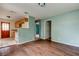 Shows the living room and kitchen with hardwood flooring, and open doorways at 4479 Newark N St, St Petersburg, FL 33714