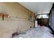Covered patio featuring a water heater and view of the fenced yard at 4479 Newark N St, St Petersburg, FL 33714