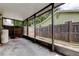 Enclosed patio with black posts and a view of the wooden fence at 4479 Newark N St, St Petersburg, FL 33714