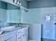 Contemporary bathroom with a frameless glass shower and double vanity at 4510 Big Woods Way, Parrish, FL 34219