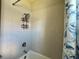 Bathroom features shower with gray tiled surround and modern fixtures at 4510 Big Woods Way, Parrish, FL 34219