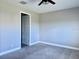 Cozy bedroom with ceiling fan and carpet flooring at 4510 Big Woods Way, Parrish, FL 34219