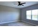 Bedroom featuring a ceiling fan, window and carpeted floor at 4510 Big Woods Way, Parrish, FL 34219
