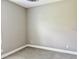 This bedroom features neutral paint, white trim, and soft, natural light at 4510 Big Woods Way, Parrish, FL 34219