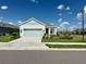 Charming single-story home with a well-maintained lawn and a two-car garage at 4510 Big Woods Way, Parrish, FL 34219